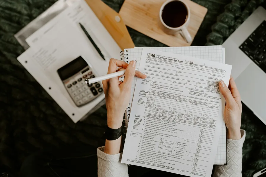 Illustrative stock photo: hands reviewing paperwork